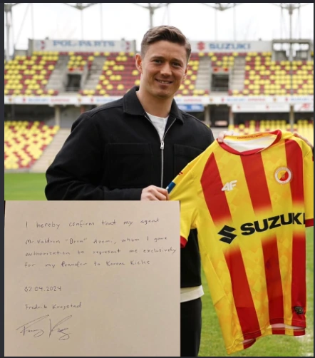 Fredrik Krogstad holding his new club shirt and signed representation letter